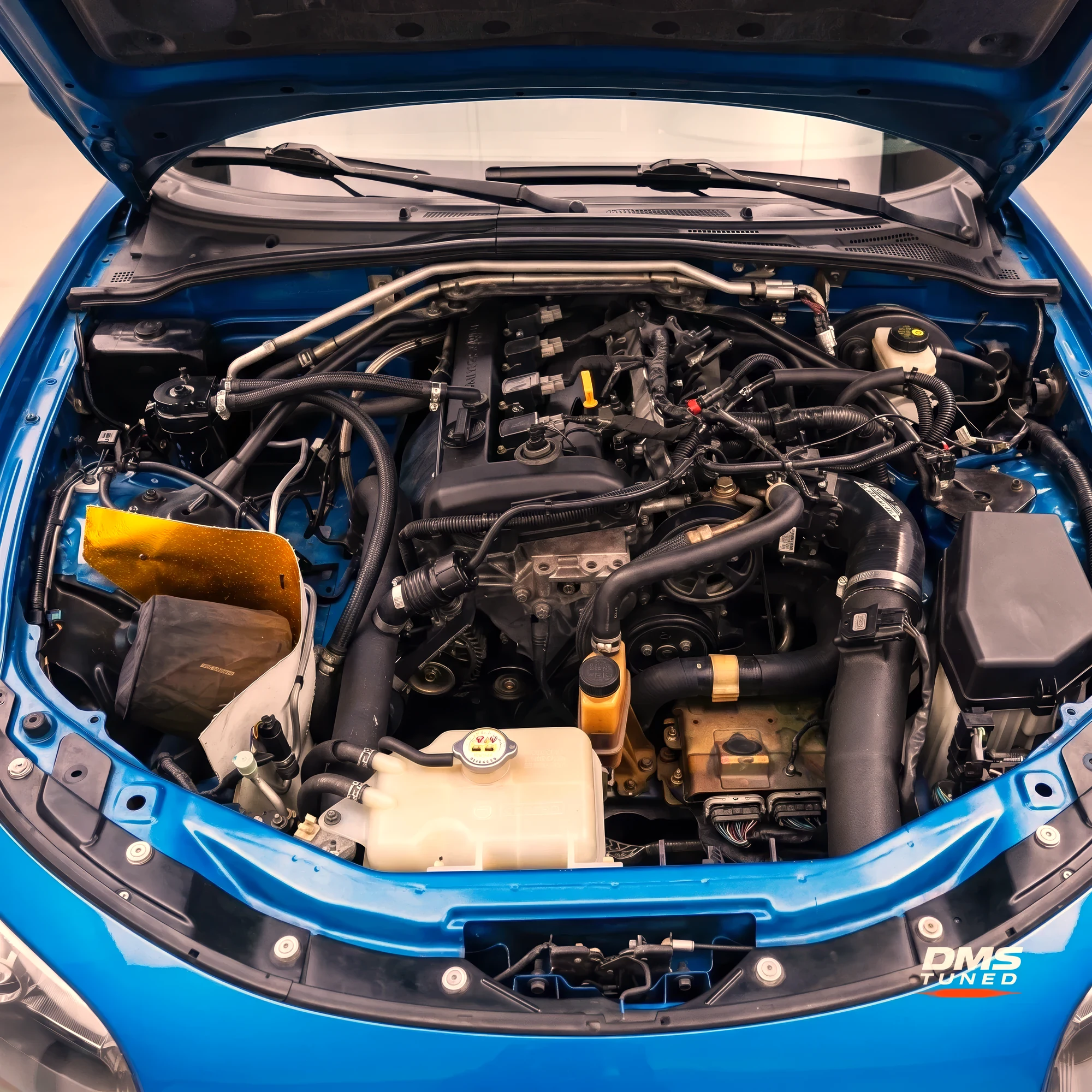 DMS Tuned custom low-mount turbo kit fitted to a Mazda MX-5 NC engine bay